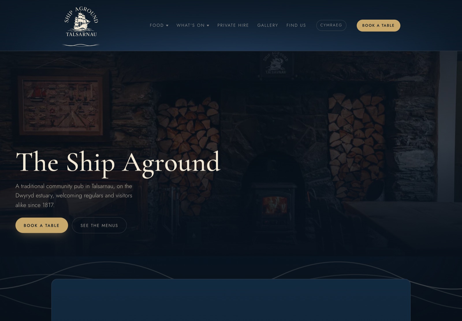 The Ship Aground website homepage, navy and cream with the pub's ship emblem