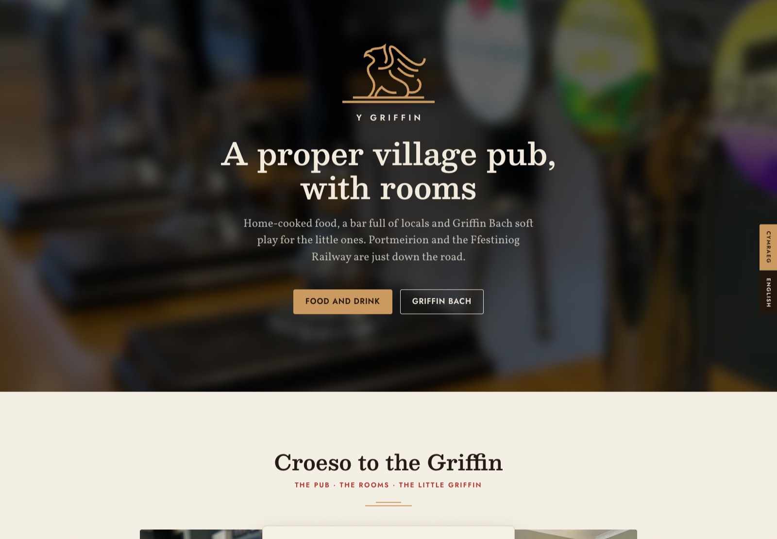 The Y Griffin website homepage, cream and chestnut with a gold griffin emblem over a photograph of the bar